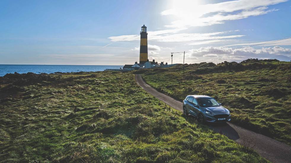 Ford kuga in front of lighthouse